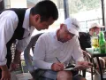corn seen paying a check